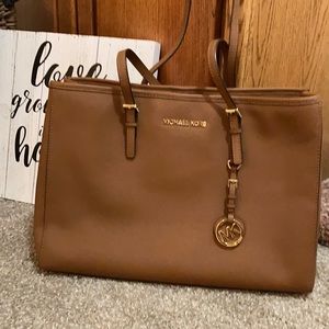 Michael Kors large jet set bag. Color is Luggage.